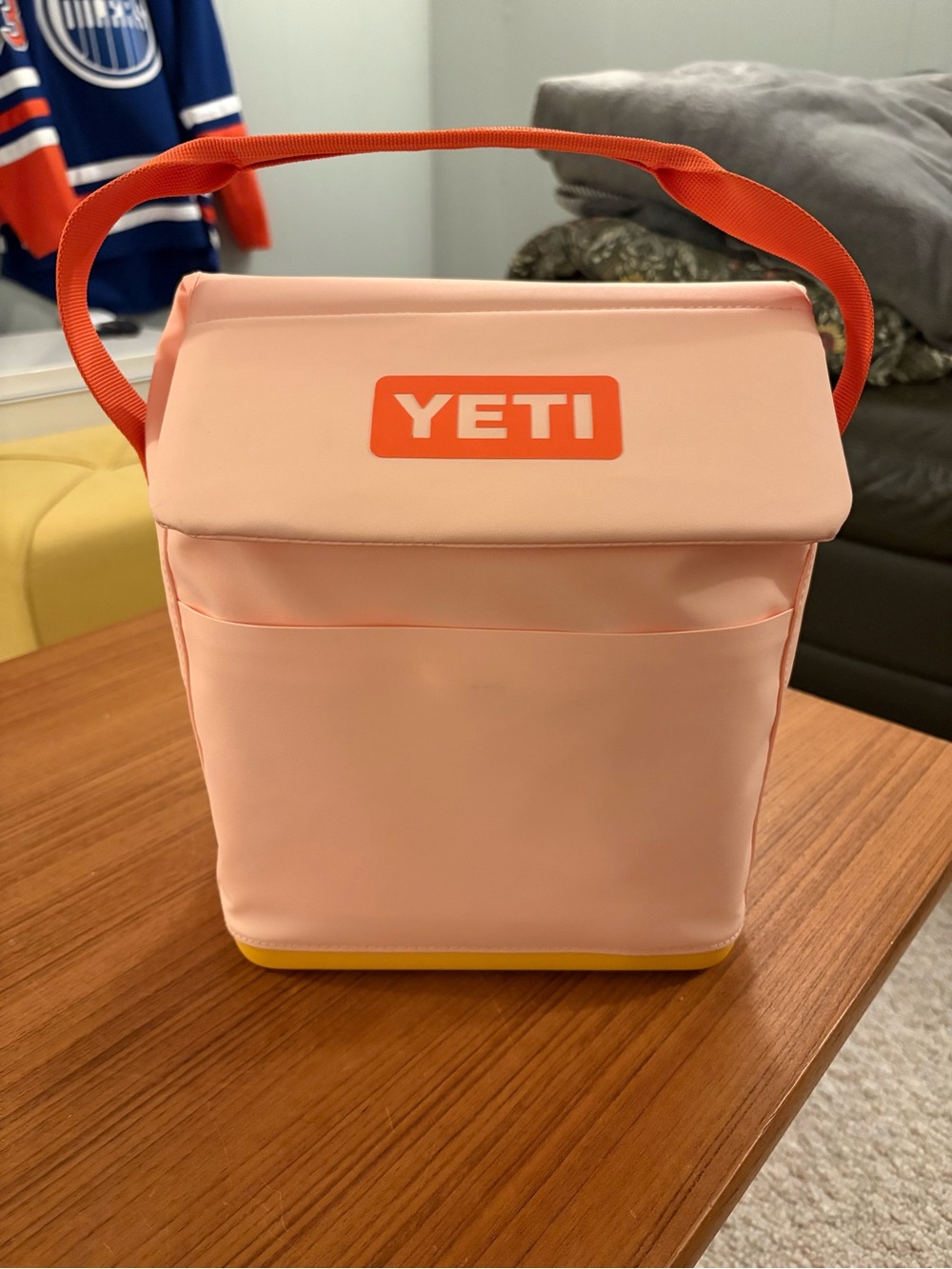Yeti Peach Cooler Bag with Orange Handle and Yellow Base